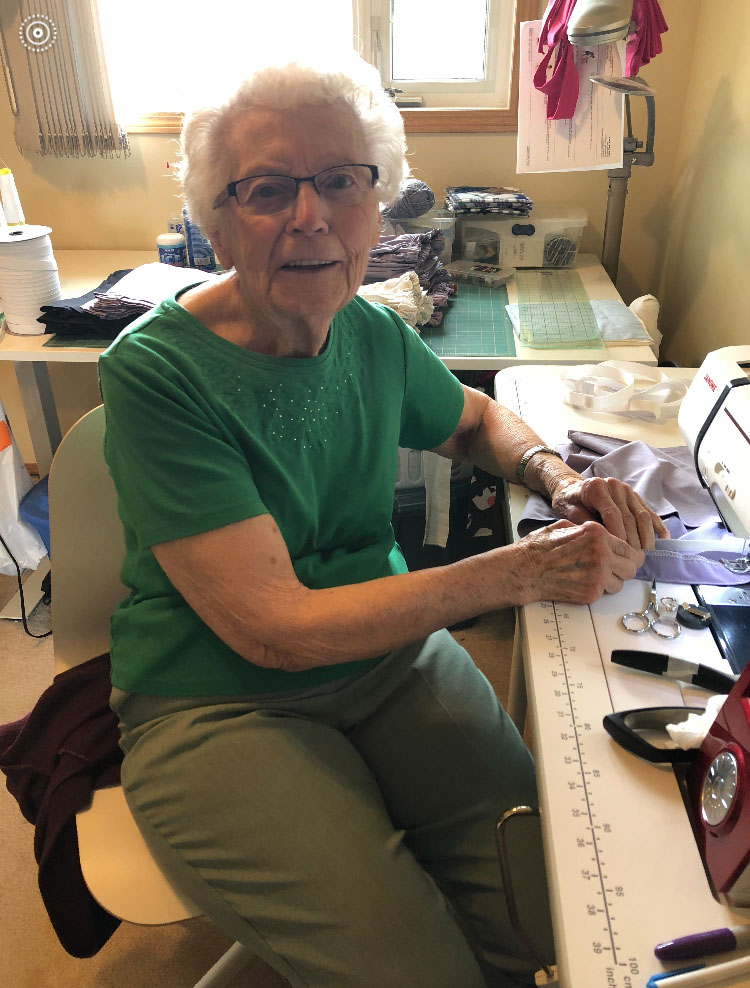 A member of the sewing bees gets down to work.